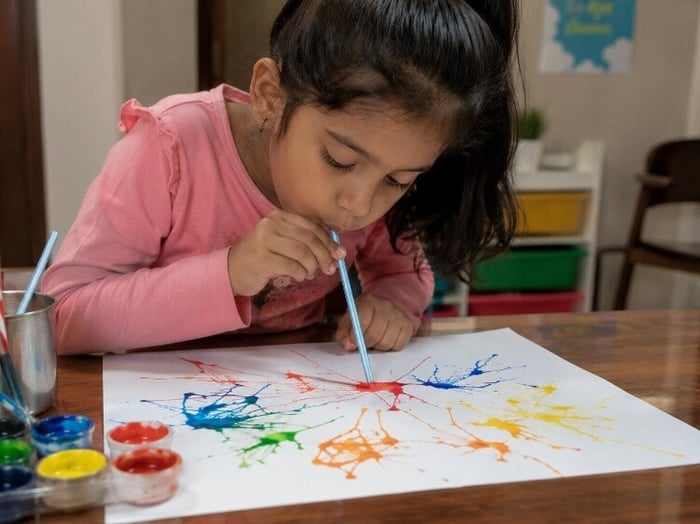 Blow painting with straws