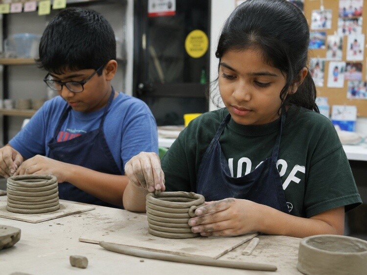 Coil pots using rolled clay ropes
